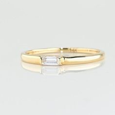 14k Solid Gold Dainty Baguette Ring. Real Gold Stackable Baguette Band, Premium Baguette Ring For Her with premium grade D Color (colorless) VS/SI clarity moissanite.  💙 Our jewelry is handcrafted with love and great care at San Francisco Bay! All of our items are 14k stamped for authenticity. 💙 You will receive them exactly as pictured. We don't use any filters, all photos are authentic and unedited. 💙 Band thickness is 2.00 mm. The ring material is 14k Solid gold, should not be confused with gold plating or filling. It won't tarnish or fade over time. 💙 We're offering the finest quality in solid gold jewelry. 💙 Quick shipping - Your order will be handcrafted and shipped 3 to 5 next business days. 🎁 They are delivered in a nice jewelry box, ready to be presented as a precious gift. Baguette Ring Band, Custom Gemstone Rings, Baguette Band, Alexandrite Jewelry, Green Gemstone Ring, Baguette Diamond Rings, Baguette Ring, Diamond Stacking Rings, Emerald Diamond Ring