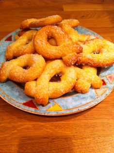 fried onion rings on a plate with ketchup