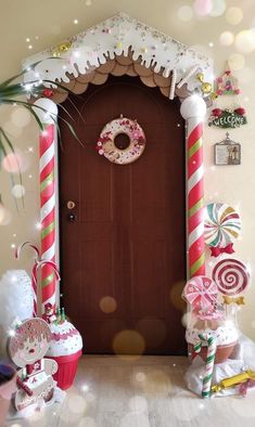 a door decorated with candy canes and decorations