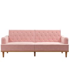 a pink couch sitting on top of a wooden frame