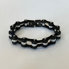 Black Bike Chain Bracelet With Clear Stones. No Flaws Or Signs Of Wear. Measurements Are Shown In Photos. Metal Is Stainless Steel. Modern Black Metal Chain Bracelet, Trendy Black Chain Link Bracelet, Trendy Black Chain Link Jewelry, Black Adjustable Chain Link Bracelet, Black Chain Link Edgy Jewelry, Trendy Black Metal Chain Bracelet, Edgy Black Chain Link Jewelry, Black Stainless Steel Chain Bracelet With Adjustable Chain, Trendy Adjustable Black Chain Bracelet