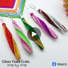 glitter foam crafts are displayed on a table