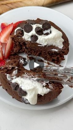 a chocolate cake with whipped cream and strawberries