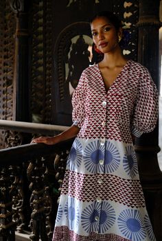 Whether you're heading to a garden party, a summer soirée, or a brunch with friends, this dress will be your trusty companion. Featuring our bold hand block print in a feminine silhouette, this dress features billowy sleeves and a flattering neckline. We believe you have a right to know how their product was made. 3.5 meters of cotton fabric sourced from Jaipur has been used for this piece. Hand printed by our artisans in Jaipur, manufactured in our workshop at Pune India. This product is hand-printed in Jaipur, India using traditional techniques. Subtle variations in patterns are natural to this process. We believe this makes each creation unique and charming. If you wish to have the length of the garment altered, please mention your request in the special instructions section at checkout Billowy Sleeves, Dress Stands, Summer Soiree, Block Dress, Feminine Silhouette, Hand Block Print, Block Printing Fabric, Jaipur India, Traditional Techniques