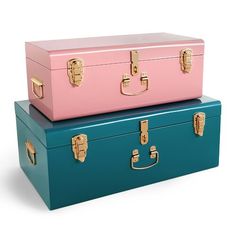 two suitcases sitting side by side on top of each other, one pink and one blue