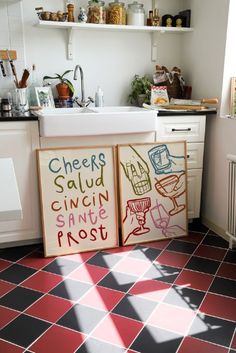 the kitchen is clean and ready for us to use it's colorful floor tiles