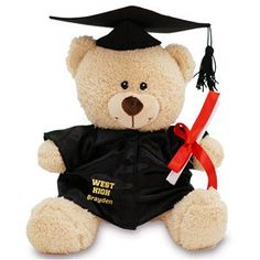 a teddy bear wearing a graduation cap and gown