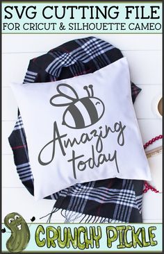 a pillow with the words amazing today on it and some sewing supplies next to it