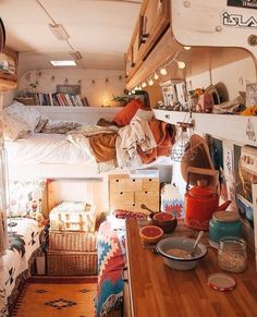 a bedroom with bunk beds and lots of clutter