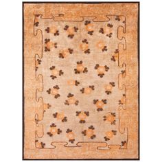 an orange and brown rug with flowers on the bottom, in front of a white background