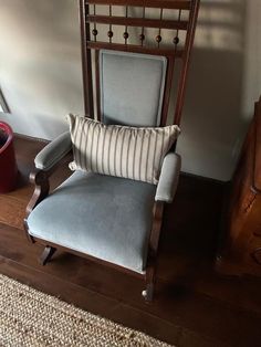 a chair with a striped pillow on top of it