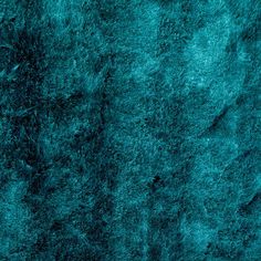 the texture of an animal's fur is very bright blue and dark teal