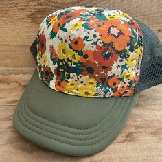 Vintage Floral Fabric bringing back the best looks.   All hats have a terry cloth lining, mesh back, and snap adjustable back. We believe in individual expression,  hand crafting, and getting outside.  Our hats are meant to instill adventure in you whenever you wear them!   Stitching is random.  If you desire a certain color (or don't want a certain color) please write in notes.  All our hats are hand stitched by us, local women,  or our team of lady stay at home mom seamstresses in L.A.  Every hat is unique as they are not mass produced.  We buy our fabrics from small fabric designers or work closely with artists or textile makers. Some fabric is custom made through working directly with artists and made in limited batches.  Customers come back again and again as our hats are comfortable, Adjustable Green Mesh Snapback Hat, Green Adjustable Mesh Snapback Hat, Spring Mesh Baseball Cap, Green Trucker Hat For Beach, Green Trucker Hat For The Beach, Green Mesh Summer Hat, Summer Green Mesh Hat, Mesh Snapback Hat One Size, Spring Mesh Trucker Hat