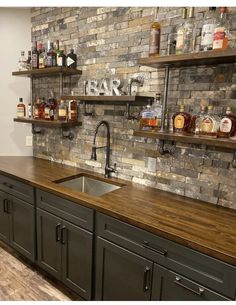 a kitchen with brick wall and wooden counter tops