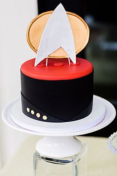 a cake with a star trek theme on it sitting on top of a white plate