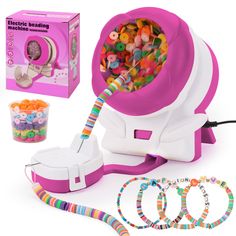 the electronic beading machine is pink and has lots of beads in front of it