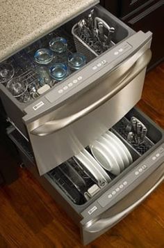 an open dishwasher drawer in a kitchen