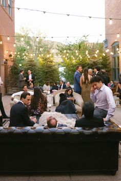 a group of people sitting on top of a couch