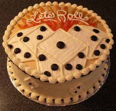 a white cake with black dots on it