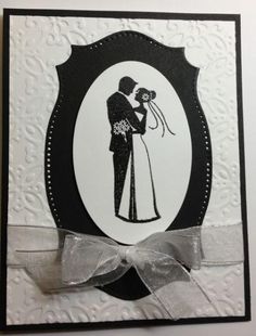 a wedding card with a silhouette of a bride and groom