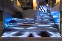 the stairs are lit up with blue lights and there is no image here to provide a caption for