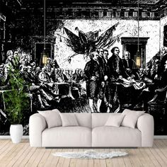 a living room with a large mural on the wall and couch in front of it