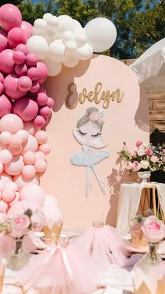 a table with balloons and decorations for a ballerina birthday party