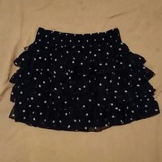 Never Worn. Can Be Worn As Waisted. Has Elastic Around The Band. Chic Polka Dot Mini Skirt, Polka Dot Flowy Skirt With Ruffles, Flowy Polka Dot Skirt With Ruffles, Polka Dot Ruffled Skirt For Summer, Polka Dot Ruffled Flowy Skirt, Casual Polka Dot Bottoms For Party, Casual Polka Dot Ruffled Skirt, Polka Dot Casual Party Bottoms, Casual Ruffled Polka Dot Skirt