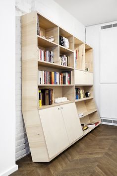 a bookshelf that is made out of plywood