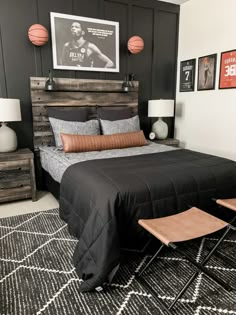 a bedroom with a bed, nightstands and pictures on the wall