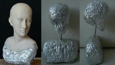 there is a plastic head that has been wrapped in tin foil