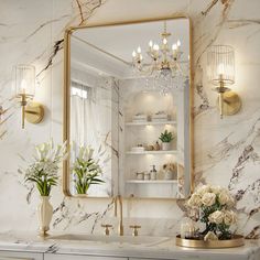 a bathroom with marble counter tops and gold accents