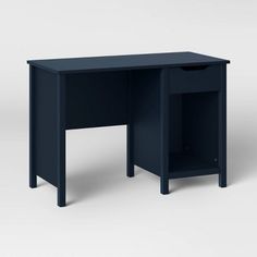 the desk is dark blue and has an open drawer on it's left side