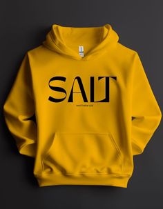 In Matthew 5:13, Jesus is using the metaphor of salt to teach a lesson. Salt is a substance that adds flavor and preserves food. Similarly, Jesus is telling his followers that they are like salt for the world. We are meant to bring goodness, kindness, and positive influence to the people around us. Be the salt of the earth. This sweatshirt, made of our soft fleece fabric, is a comfy and stylish reminder of our divine purpose. Key Features: Empowering Message: This sweatshirt is more than just a Christian T Shirt Design Ideas, Clothing Brands To Shop At, Branded Hoodies, Savage Logo, Church Shirt Designs, Dc Clothing, Jesus Apparel, Matthew 5 13, Divine Purpose