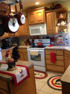 a kitchen with wooden cabinets and white appliances