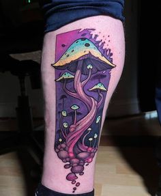 a tattoo on the leg of a person with an octopus and jelly fish in it