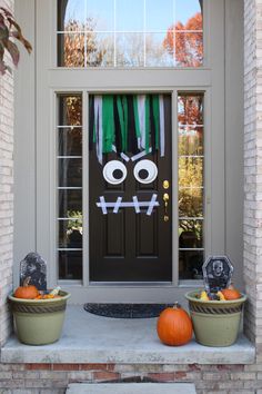 the front door is decorated for halloween with decorations