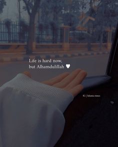 someone holding their hand out the window of a car that says life is hard snow, but alhamdulith