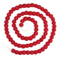 a red beaded necklace on a white background