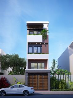 a white car is parked in front of a two story building with plants on the balconies