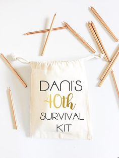 a drawstring bag with the words danis 10th survival kit written on it