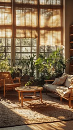 the sun shines through two large windows into a living room filled with furniture and plants