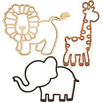 three wooden cutouts of animals and an elephant