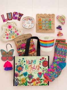 an assortment of crafting items displayed on a white wall with the words happy birthday written in large letters