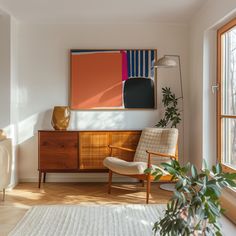 a living room filled with furniture and a painting on the wall