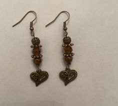 Love charms. Retro brass filigree heart charm with tigers eye crystal grass bead  French wire Dangling Earrings.Total l Length: 2.3 inches.   Comes in a velvet pouch and gift box. will ship worldwide. Tigers Eye Crystal, Filigree Heart, Brass Filigree, Tiger Eye Crystal, Love Charms, French Wire, Velvet Pouch, Dangling Earrings, Tigers Eye