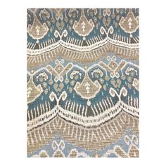 a blue and beige rug with an intricate design on the bottom half of it,