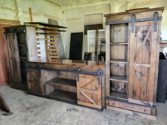 an old wooden cabinet with sliding doors and shelves