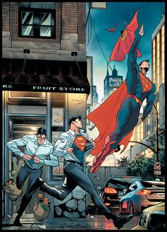 two men in suits and capes are flying through the air over a city street