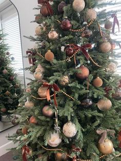 a decorated christmas tree with ornaments on it